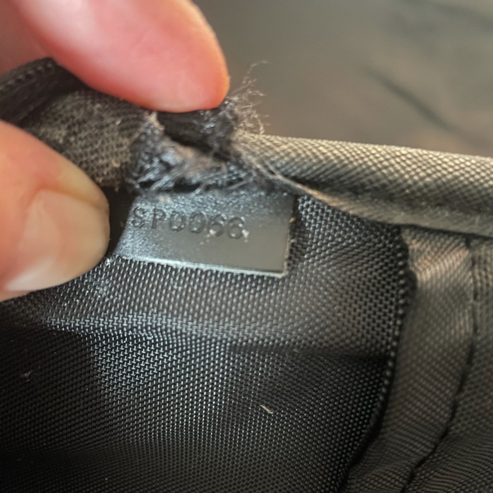 This is a Louis Vuitton travel bag black. - Picture 16 of 16